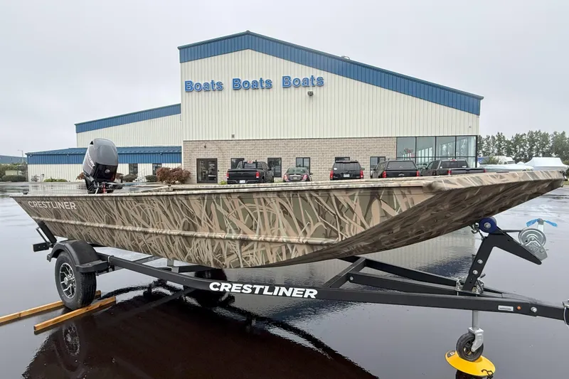 Slide: The Image of 2025 Crestliner 1760 Retriever Jon Deluxe boat on trailer outside dealership. - 21