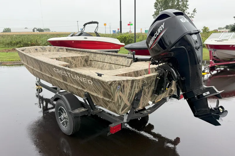 Slide: The Image of 2025 Crestliner 1760 Retriever Jon Deluxe boat with Mercury engine on trailer. - 22