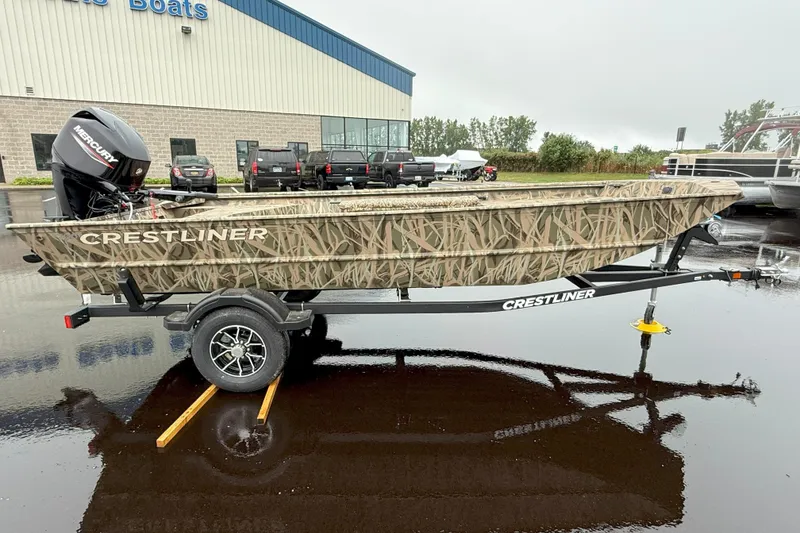 Slide: The Image of 2025 Crestliner 1760 Retriever Jon Deluxe boat on trailer, camo design, parked outdoors. - 23