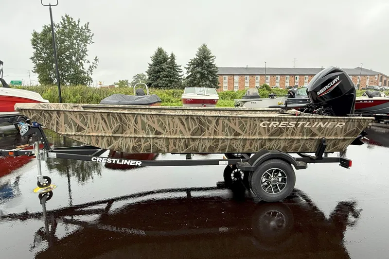 Slide: The Image of 2025 Crestliner 1760 Retriever Jon Deluxe boat on trailer, camo design, parked outdoors. - 25