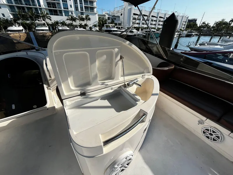 Slide: The Image of 2001 Fairline Squadron 55 yacht interior with open sink and marina view. - 12