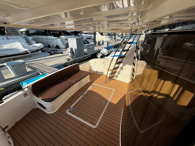 Slide: The Image of Luxurious 2001 Fairline Squadron 55 yacht deck with seating and ladder. - 13