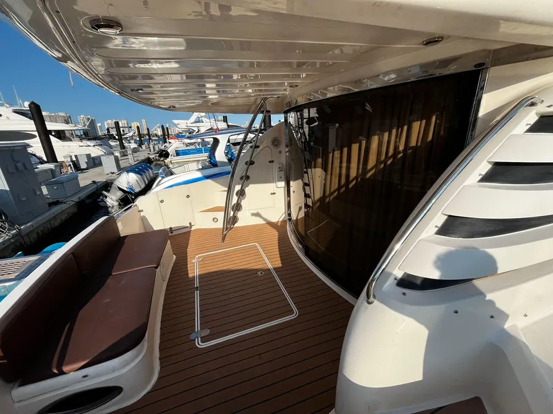 Slide: The Image of 2001 Fairline Squadron 55 yacht deck with seating, docked at marina. - 15