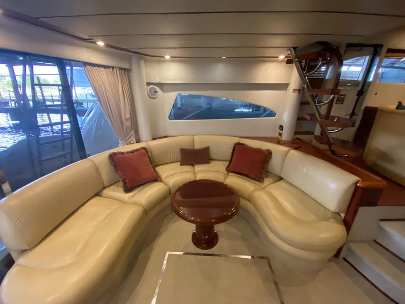 Slide: The Image of Luxurious interior of 2001 Fairline Squadron 55 yacht with elegant seating and wooden accents. - 17