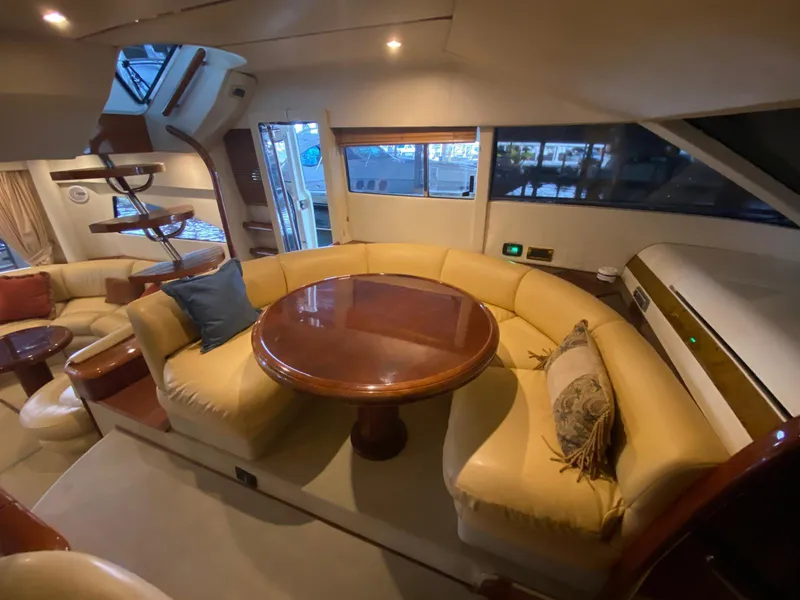 Slide: The Image of Luxurious interior of 2001 Fairline Squadron 55 yacht with elegant seating and wooden table. - 18