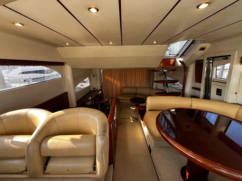Slide: The Image of Luxurious interior of 2001 Fairline Squadron 55 yacht with elegant seating and dining area. - 21