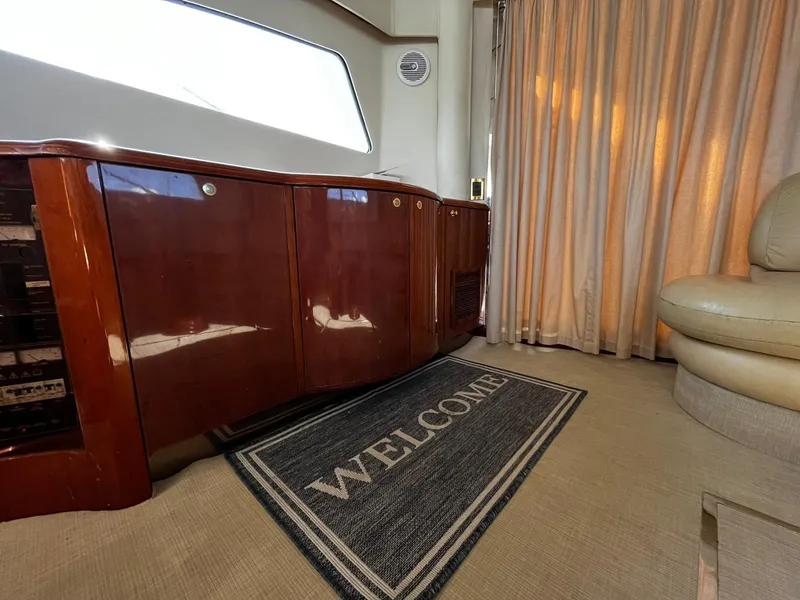 Slide: The Image of Luxurious interior of 2001 Fairline Squadron 55 yacht with welcome mat and elegant furnishings. - 22