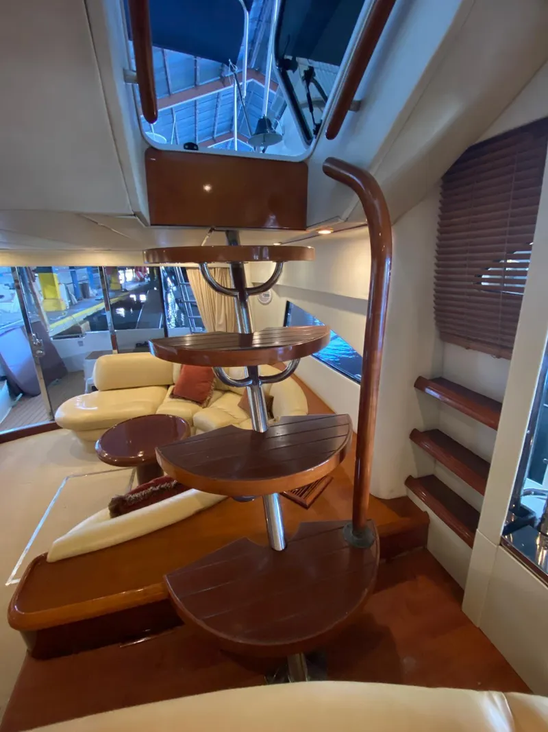 Slide: The Image of Interior of 2001 Fairline Squadron 55 yacht with elegant wooden spiral staircase. - 25