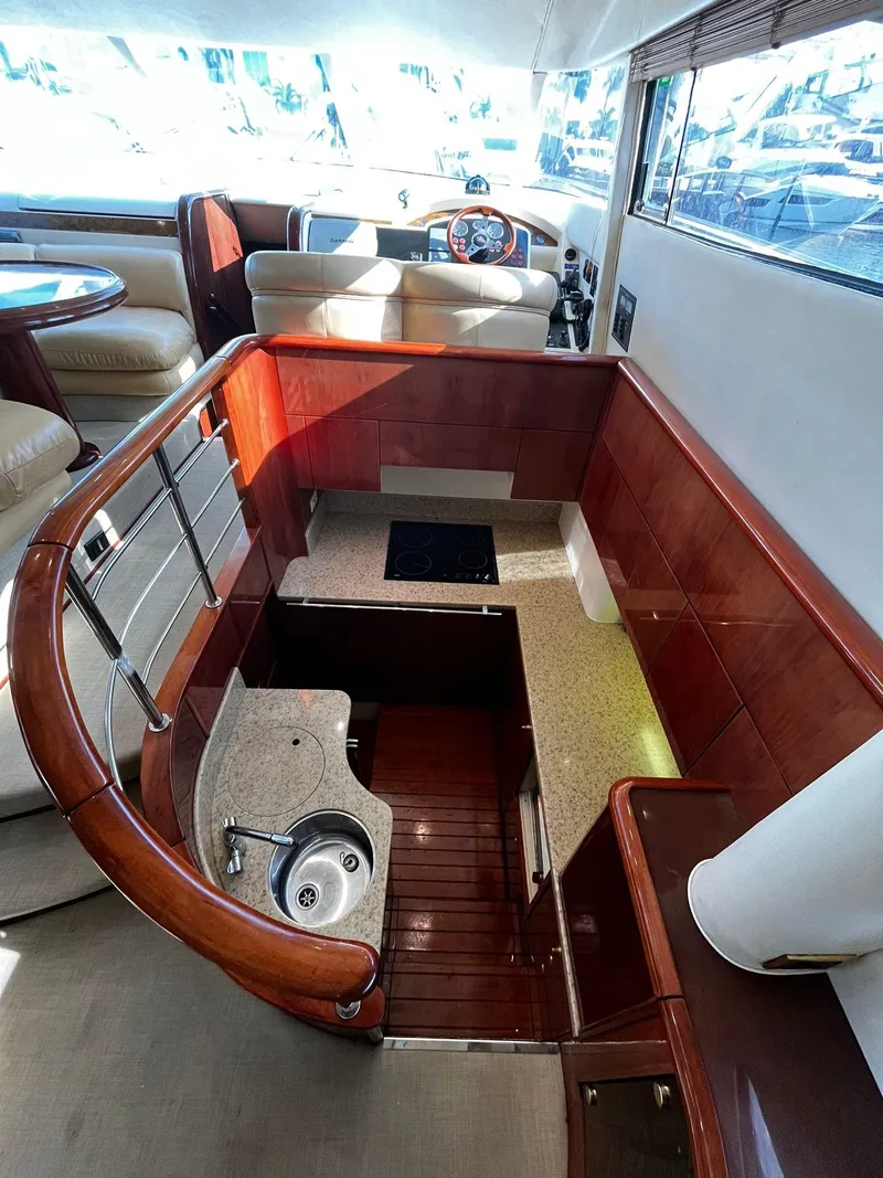 Slide: The Image of Luxurious interior of 2001 Fairline Squadron 55 yacht with modern kitchen and seating area. - 26