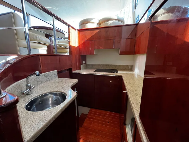 Slide: The Image of Luxurious kitchen interior of 2001 Fairline Squadron 55 yacht with wood and granite finishes. - 27