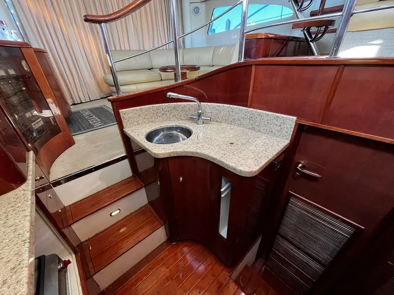 Slide: The Image of Luxurious interior of 2001 Fairline Squadron 55 yacht with elegant wood and granite finishes. - 28