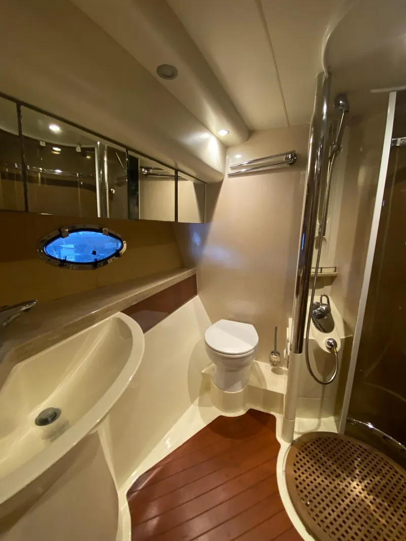 Slide: The Image of Luxurious bathroom in 2001 Fairline Squadron 55 yacht with modern fixtures and wooden flooring. - 35