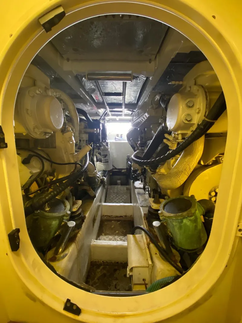 Slide: The Image of Engine room of 2001 Fairline Squadron 55 yacht, showcasing mechanical components and equipment. - 36