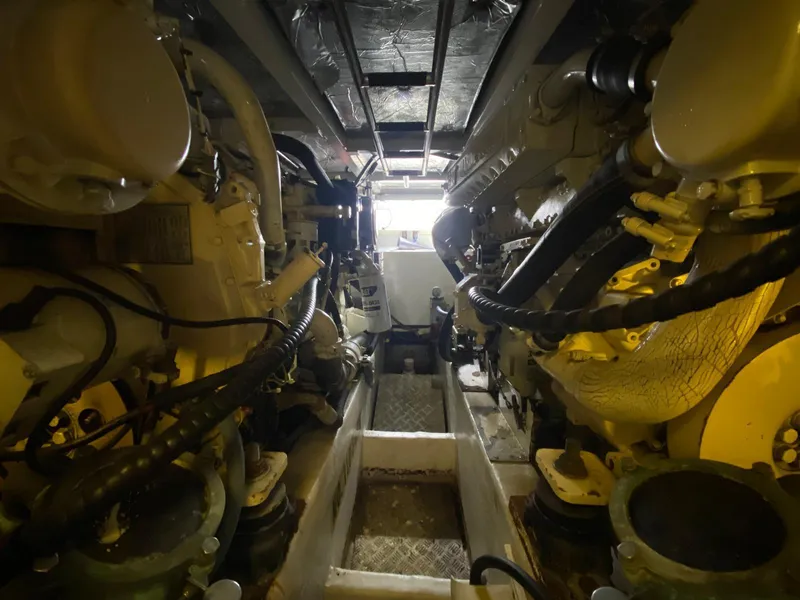 Slide: The Image of Engine room of 2001 Fairline Squadron 55 yacht, showcasing dual engines and mechanical components. - 37