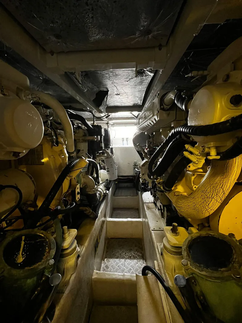 Slide: The Image of Engine room of a 2001 Fairline Squadron 55 yacht, showcasing mechanical components. - 41