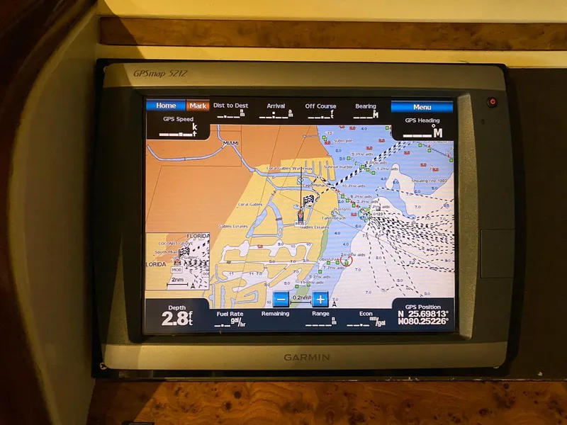 Slide: The Image of Garmin GPS display on 2001 Fairline Squadron 55 yacht, showing nautical map and navigation details. - 43