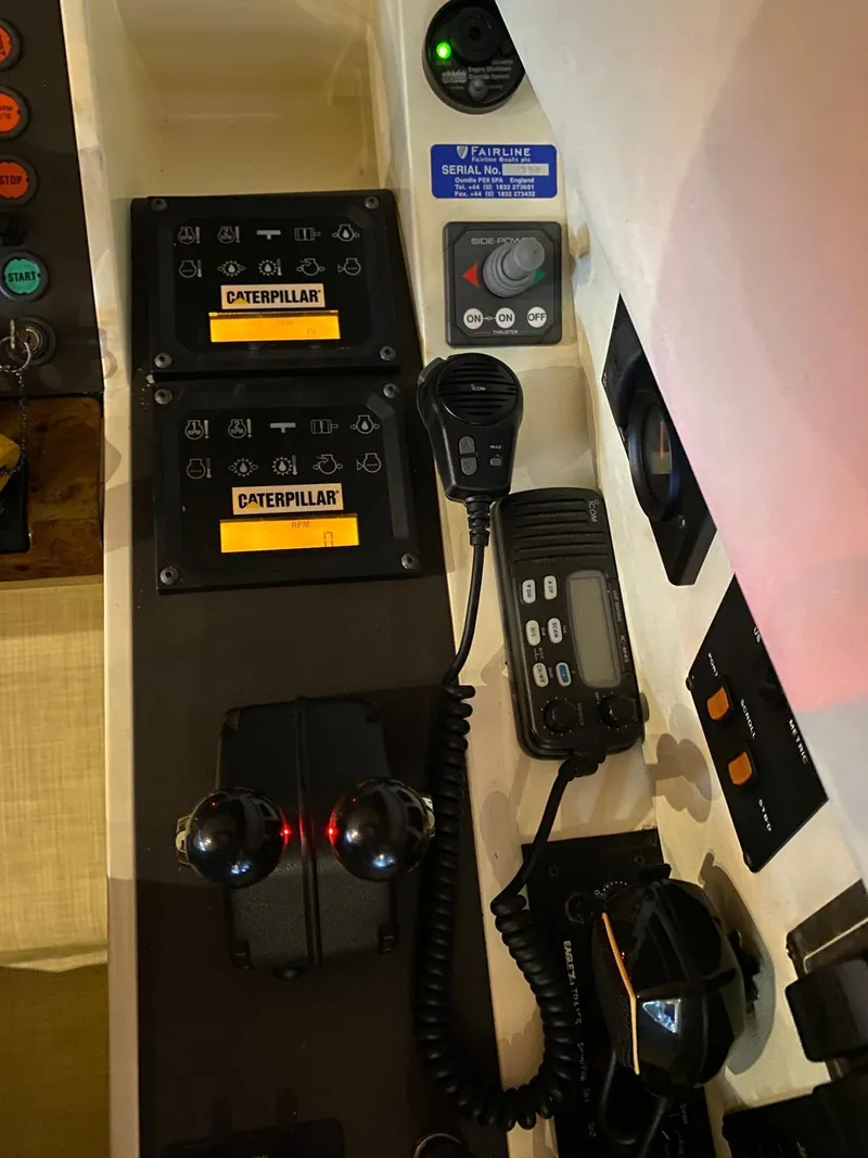 Slide: The Image of Control panel of a 2001 Fairline Squadron 55 yacht with Caterpillar engine controls. - 44