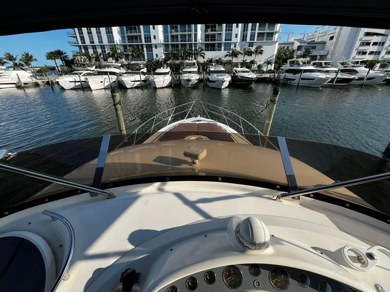 Slide: The Image of View from the helm of a 2001 Fairline Squadron 55 yacht in a marina. - 5