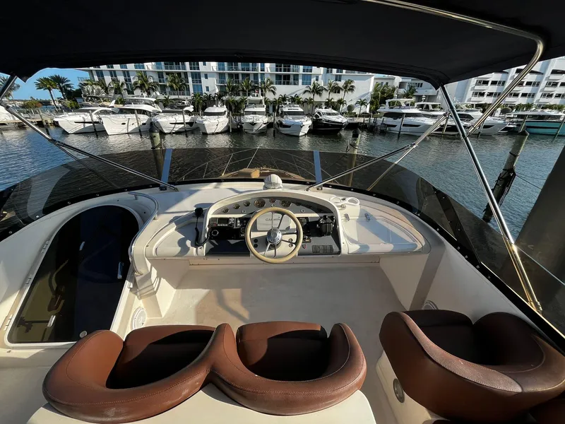Slide: The Image of Flybridge of 2001 Fairline Squadron 55 yacht with marina view. - 8