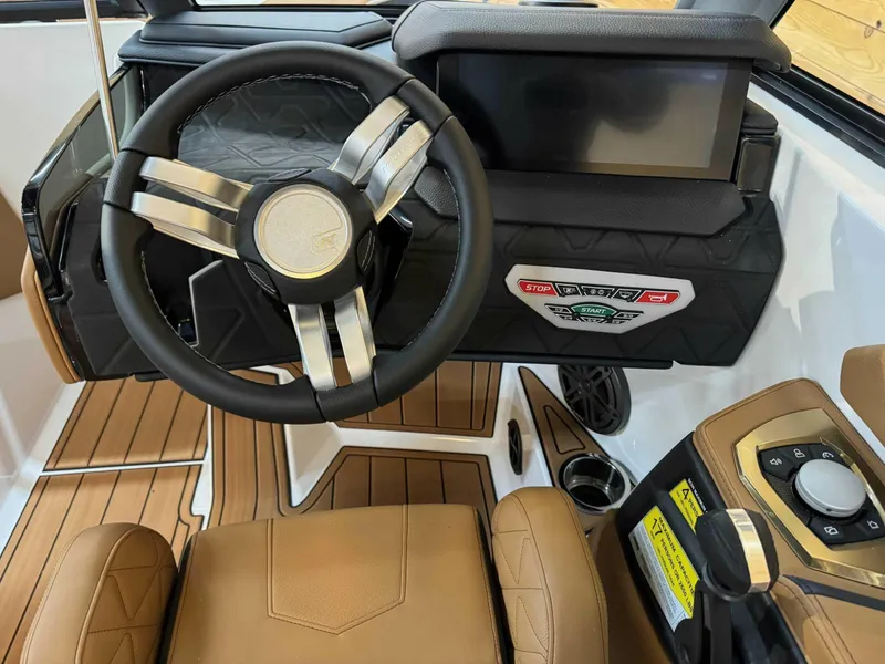 Slide: The Image of 2024 Nautique GS24 boat interior with steering wheel and control panel. - 6