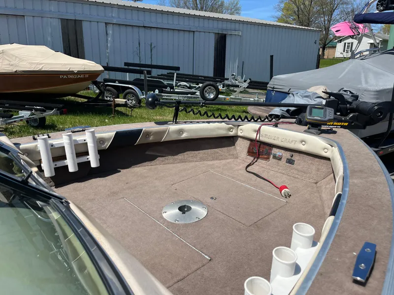 Slide: The Image of 1997 Smoker Craft 170 PHANTOM boat interior with rod holders and equipment. - 2