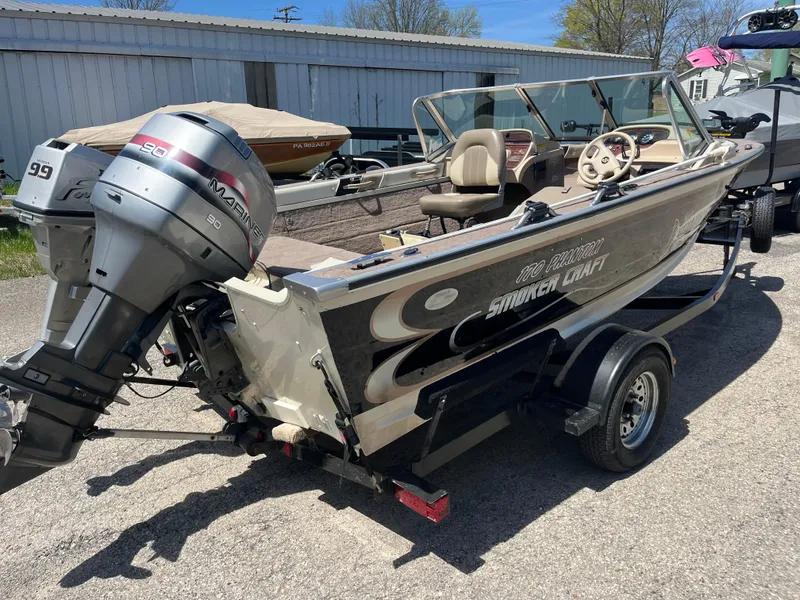 Slide: The Image of 1997 Smoker Craft 170 PHANTOM boat with outboard motor on trailer. - 8