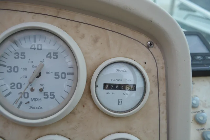 Slide: The Image of 1997 Cruisers Yachts 3120 Aria dashboard with speedometer and hour meter. - 12