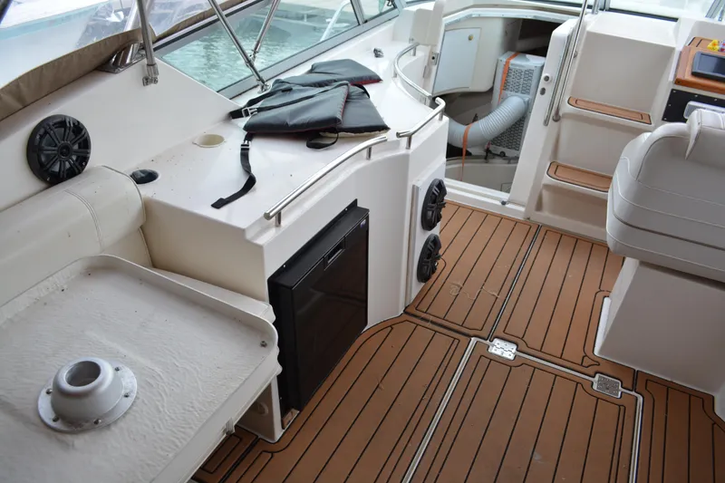 Slide: The Image of 1997 Cruisers Yachts 3120 Aria interior with wood flooring and seating area. - 20
