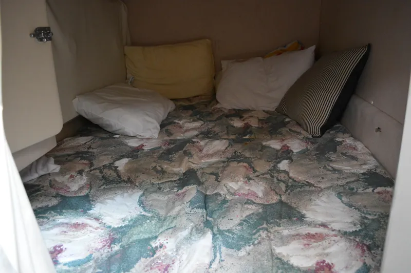 Slide: The Image of Cozy cabin interior of 1997 Cruisers Yachts 3120 Aria with floral bedding and pillows. - 27