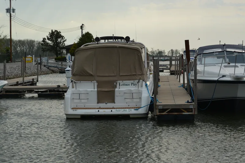 Slide: The Image of 1997 Cruisers Yachts 3120 Aria docked at marina, rear view. - 5