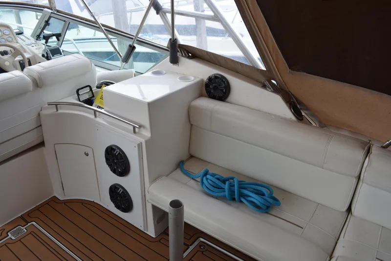 Slide: The Image of 1997 Cruisers Yachts 3120 Aria interior with white seating and blue rope. - 19