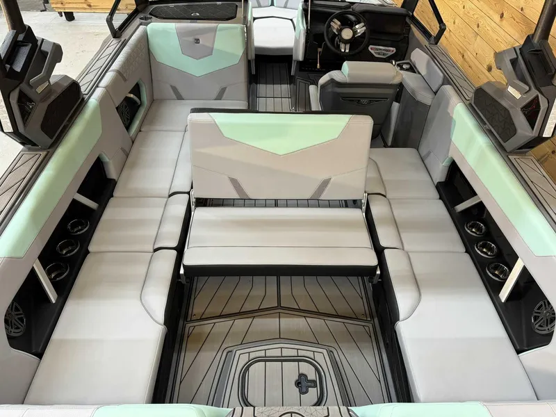 Slide: The Image of 2025 Nautique GS22 boat interior with modern seating and sleek design. - 10