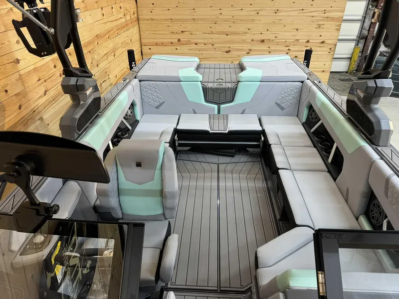 Slide: The Image of 2025 Nautique GS22 boat interior with modern seating and sleek design. - 9