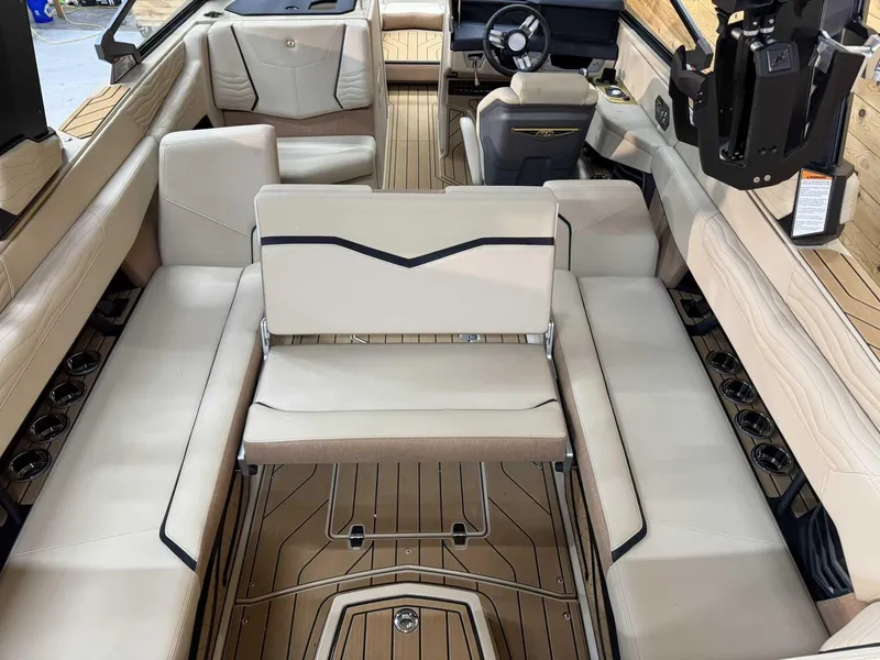 Slide: The Image of 2025 Nautique G25 boat interior with luxurious seating and modern design. - 10