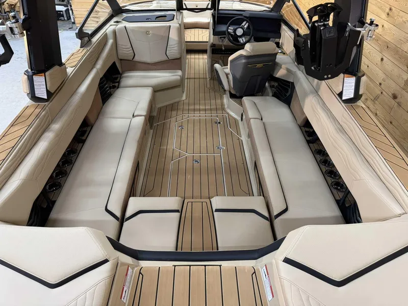 Slide: The Image of 2025 Nautique G25 boat interior with luxurious seating and modern design. - 6
