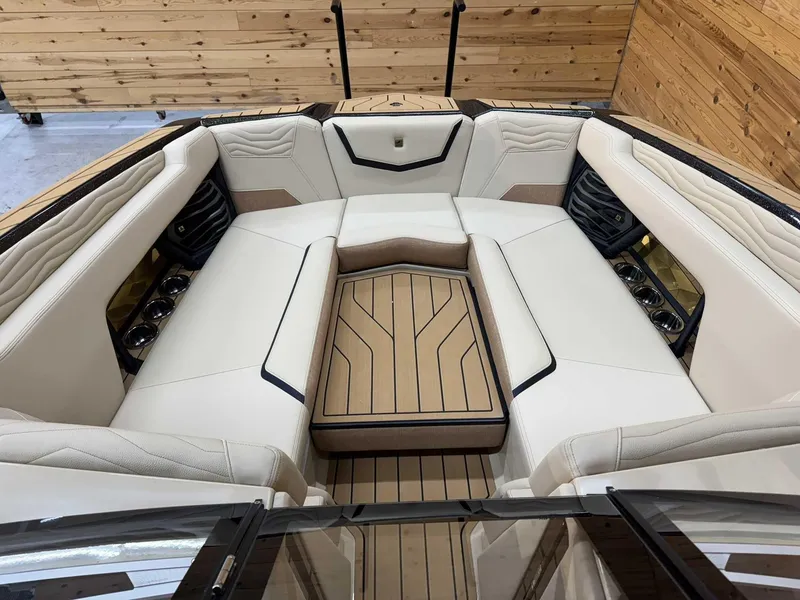 Slide: The Image of Luxurious interior of 2025 Nautique G25 boat with elegant seating and wood accents. - 8