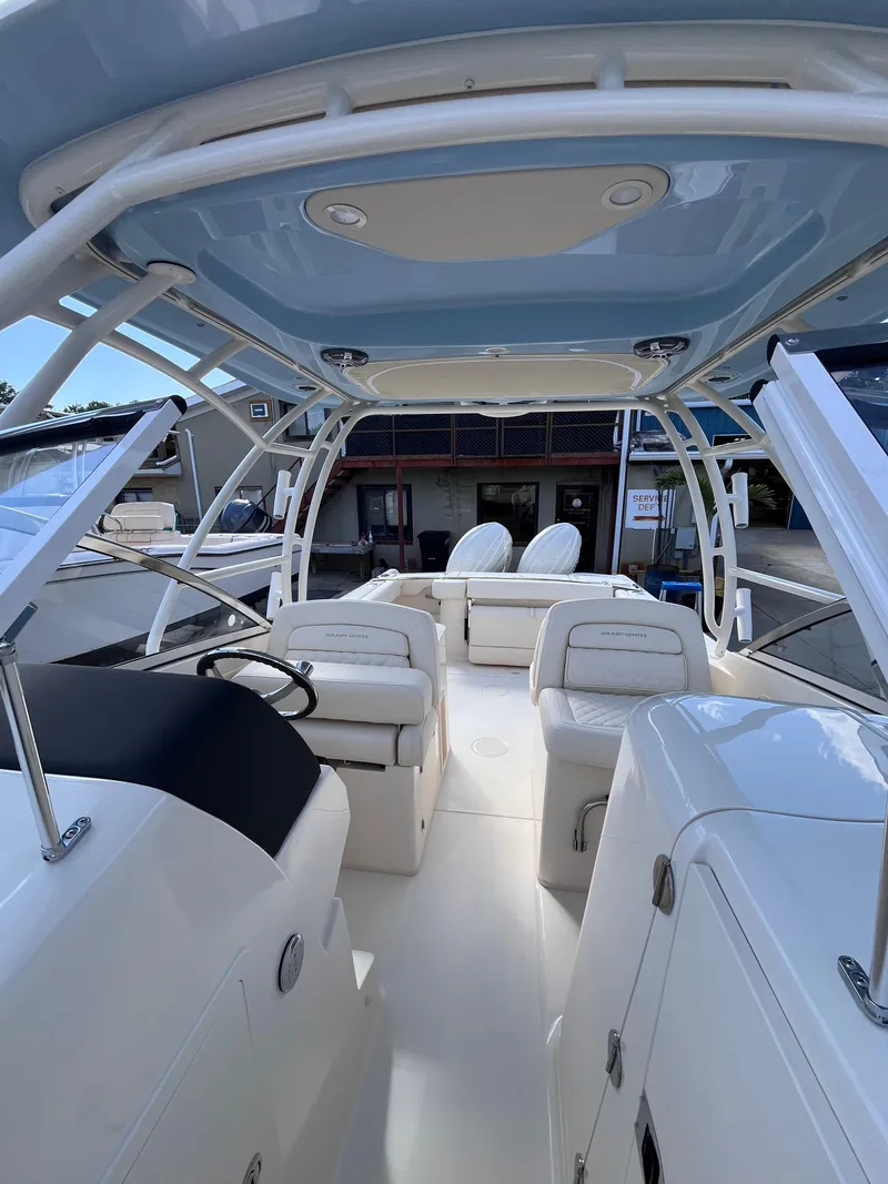 Slide: The Image of 2025 Grady-White Freedom 275 boat interior with seating and helm station. - 13