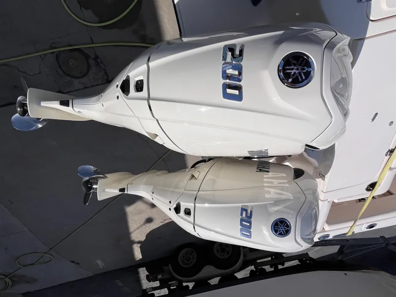 Slide: The Image of Twin 200 horsepower outboard engines on a 2025 Grady-White Freedom 275 boat. - 4