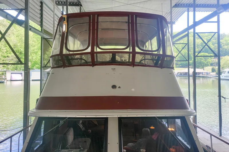 Slide: The Image of 1984 Wellcraft 44 Californian CMY docked in a covered marina. - 11