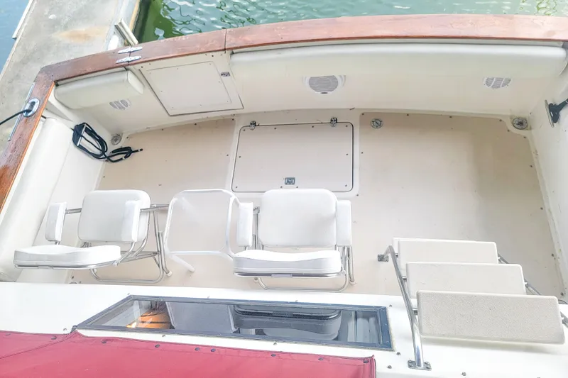 Slide: The Image of 1984 Wellcraft 44 Californian CMY boat deck with seating and storage compartments. - 13