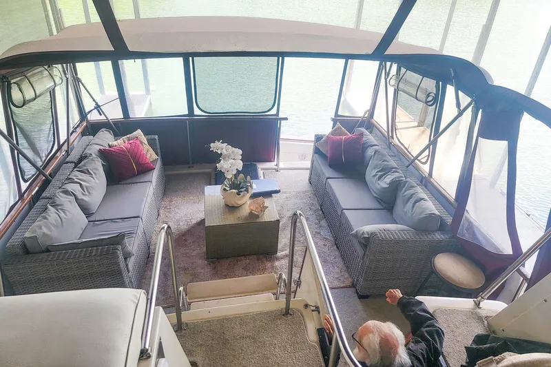 Slide: The Image of 1984 Wellcraft 44 Californian CMY yacht interior with cozy seating and decorative pillows. - 16