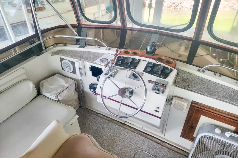 Slide: The Image of 1984 Wellcraft 44 Californian CMY helm with steering wheel and control panel. - 21