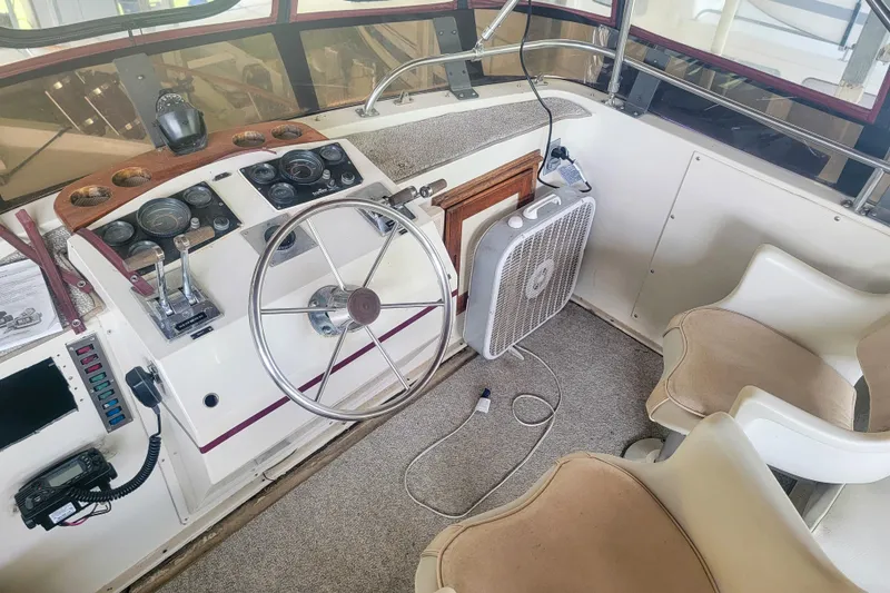 Slide: The Image of 1984 Wellcraft 44 Californian CMY helm with steering wheel, controls, and seating. - 22
