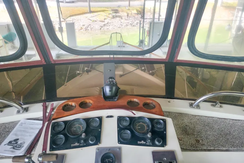 Slide: The Image of 1984 Wellcraft 44 Californian CMY helm with gauges and controls, view through windshield. - 23