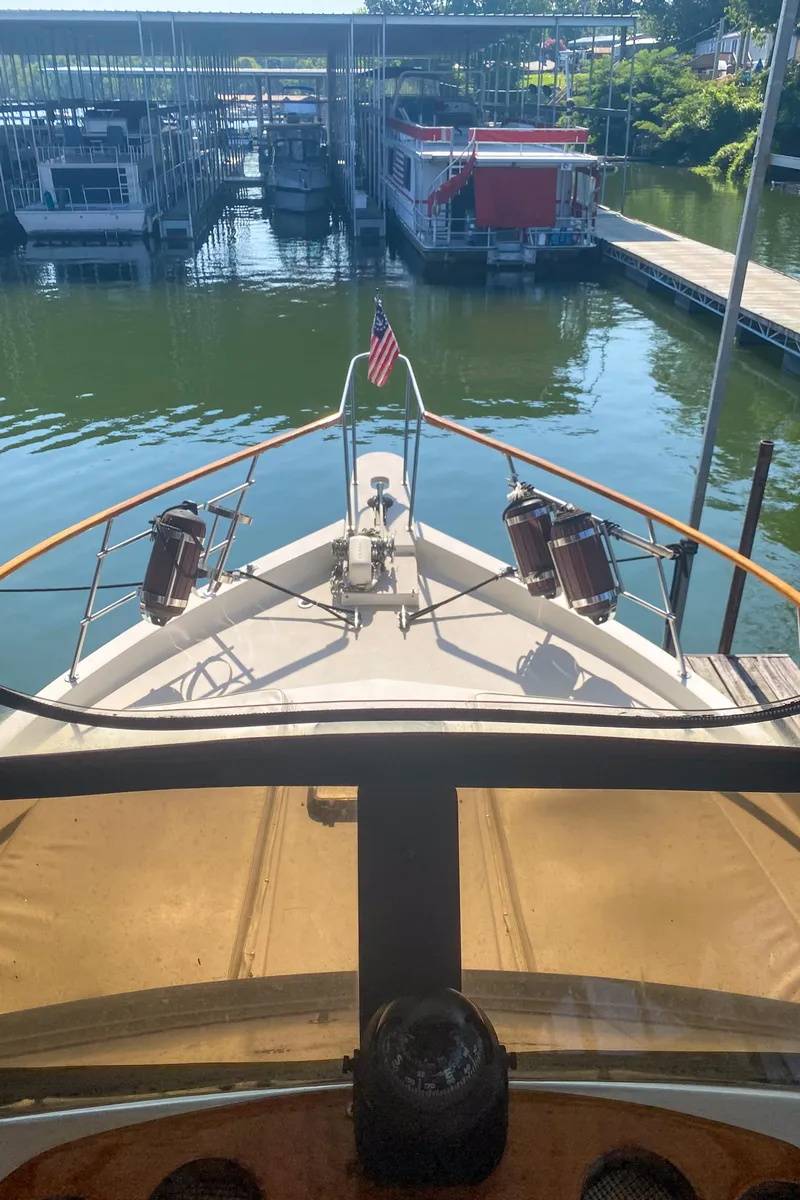 Slide: The Image of 1984 Wellcraft 44 Californian CMY yacht docked at marina, view from helm. - 31