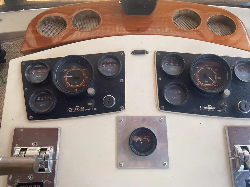 Slide: The Image of 1984 Wellcraft 44 Californian CMY dashboard with gauges and controls. - 34