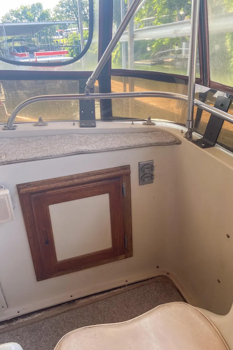 Slide: The Image of 1984 Wellcraft 44 Californian CMY interior with wooden panel and window view. - 36