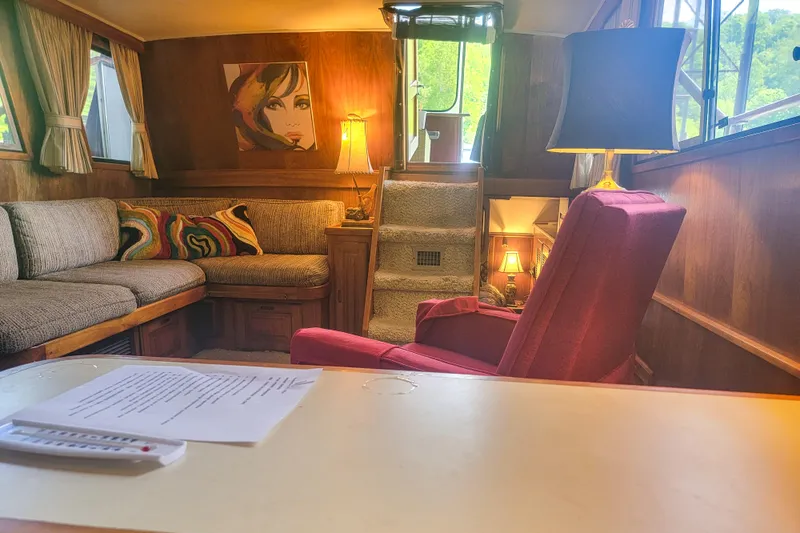 Slide: The Image of Interior of 1984 Wellcraft 44 Californian CMY yacht with cozy seating and warm lighting. - 48