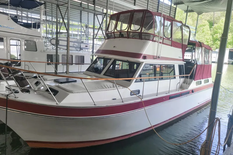 Slide: The Image of 1984 Wellcraft 44 Californian CMY yacht docked in a covered marina. - 7