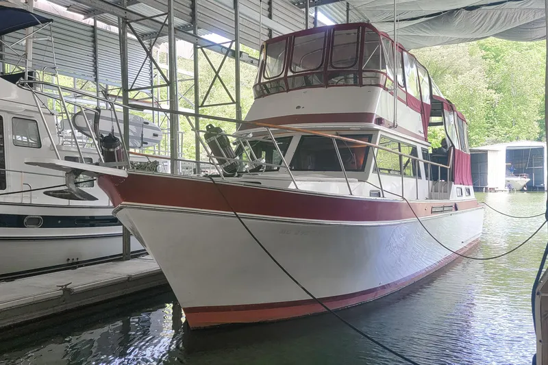 Slide: The Image of 1984 Wellcraft 44 Californian CMY docked in a covered marina. - 8